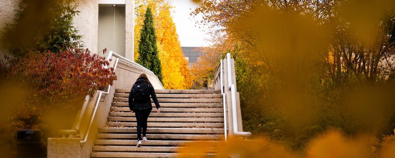 Student Walking up Exterior Stairs on Allendale Campus